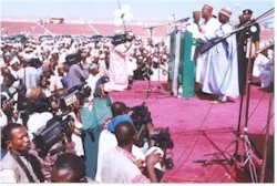 Governor Adamu addressing a large gathering during the 'Reception 2000' ceremony
